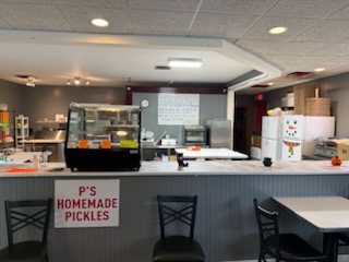 The Passetti’s counter with the homemade pickles sign